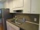 Kitchen features a stainless steel sink and ample counter space at 1900 59Th N Ave # 212, St Petersburg, FL 33714