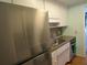 Galley kitchen with stainless steel appliances and white cabinets at 1900 59Th N Ave # 212, St Petersburg, FL 33714