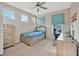 Bright bedroom with built-in dresser and desk at 2104 Park Crescent Drive, Land O Lakes, FL 34639