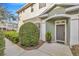 Inviting front entrance with lush landscaping and a charming walkway at 2104 Park Crescent Drive, Land O Lakes, FL 34639