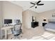 Main bedroom with a workspace, large windows, and carpeted floor at 2104 Park Crescent Drive, Land O Lakes, FL 34639