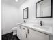 Modern bathroom with double vanity and black accents at 2318 Granada W Cir, St Petersburg, FL 33712