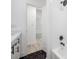 Bathroom with white subway tile and hexagon floor tile at 2318 Granada W Cir, St Petersburg, FL 33712