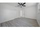 Simple bedroom with hardwood floors and ceiling fan at 2318 Granada W Cir, St Petersburg, FL 33712