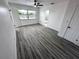 Bright bedroom with wood-look floors and private access to bathroom at 2318 Granada W Cir, St Petersburg, FL 33712