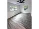 Spacious bedroom featuring gray vinyl flooring and dual windows at 2318 Granada W Cir, St Petersburg, FL 33712