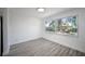 Simple dining area with large windows and wood-look floors at 2318 Granada W Cir, St Petersburg, FL 33712