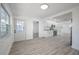 Bright dining area with wood-look flooring and kitchen access at 2318 Granada W Cir, St Petersburg, FL 33712