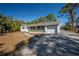 Charming ranch home with white brick exterior and driveway at 2318 Granada W Cir, St Petersburg, FL 33712