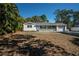 Newly renovated single story home with white brick exterior and landscaped yard at 2318 Granada W Cir, St Petersburg, FL 33712