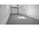 Attached garage with painted concrete floor and storage at 2318 Granada W Cir, St Petersburg, FL 33712