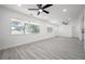 Bright living room featuring hardwood floors and large windows at 2318 Granada W Cir, St Petersburg, FL 33712