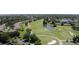 Golf course community with houses, ponds and lush green fairways at 2440 E Del Webb Blvd, Sun City Center, FL 33573