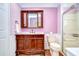 Elegant bathroom with a wood vanity and a large mirror at 2440 E Del Webb Blvd, Sun City Center, FL 33573