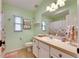 Charming bathroom with light green walls and seashell decor at 2512 Centennial Falcon Dr, Valrico, FL 33596