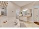 Elegant bathroom with soaking tub, double vanity, and shower at 2512 Centennial Falcon Dr, Valrico, FL 33596