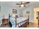 Bedroom with wood flooring, ceiling fan, and dresser at 2512 Centennial Falcon Dr, Valrico, FL 33596