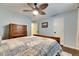 Bedroom with wood flooring, ceiling fan, and dresser at 2512 Centennial Falcon Dr, Valrico, FL 33596