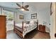 Well-lit bedroom with wood flooring and ceiling fan at 2512 Centennial Falcon Dr, Valrico, FL 33596