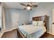 Bright bedroom with a double bed, ceiling fan, and hardwood floors at 2512 Centennial Falcon Dr, Valrico, FL 33596