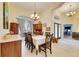 Elegant dining room with hardwood floors and a wood table at 2512 Centennial Falcon Dr, Valrico, FL 33596