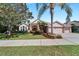 Beautiful one-story home with mature landscaping and a large driveway at 2512 Centennial Falcon Dr, Valrico, FL 33596