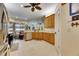 Kitchen with wood cabinets, stainless steel appliances, and tile floors at 2512 Centennial Falcon Dr, Valrico, FL 33596