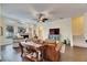 Relaxing living room with hardwood floors, a brown leather sofa, and a fireplace at 2512 Centennial Falcon Dr, Valrico, FL 33596