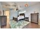 Main bedroom with tropical decor, king-size bed, and dark wood furniture at 2512 Centennial Falcon Dr, Valrico, FL 33596