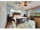 Main bedroom with tropical decor, king-size bed, and dark wood furniture at 2512 Centennial Falcon Dr, Valrico, FL 33596