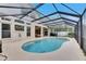 Refreshing pool and spa with covered patio and plenty of space for relaxation at 2512 Centennial Falcon Dr, Valrico, FL 33596