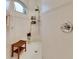 Large walk-in shower with tiled walls and a bench at 2512 Centennial Falcon Dr, Valrico, FL 33596