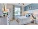 Bright bedroom with a queen-size bed and white color theme at 2562 Chapel Oak Bnd, Wesley Chapel, FL 33543