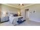 Large main bedroom with a king-size bed and ensuite bathroom at 2565 Chapel Oak Bnd, Wesley Chapel, FL 33543