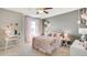 bedroom with a floral theme and a chic bed at 2577 Chapel Oak Bnd, Wesley Chapel, FL 33543