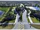 Aerial view of community entrance and homes at 2670 Tarragona Way, Wesley Chapel, FL 33543