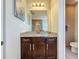 Modern bathroom with granite vanity and a large mirror at 2670 Tarragona Way, Wesley Chapel, FL 33543