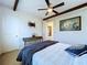 Charming bedroom with a comfortable bed and unique wall art at 2670 Tarragona Way, Wesley Chapel, FL 33543