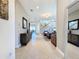 Bright and spacious entryway with a view of the living room and staircase at 2670 Tarragona Way, Wesley Chapel, FL 33543