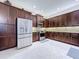 Modern kitchen with stainless steel appliances and ample dark wood cabinetry at 2670 Tarragona Way, Wesley Chapel, FL 33543