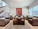 Spacious living area with plush seating, a coffee table and large artwork at 2670 Tarragona Way, Wesley Chapel, FL 33543