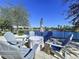 Relaxing patio seating area overlooking a lake at 2670 Tarragona Way, Wesley Chapel, FL 33543