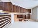 Stunning dark wood staircase viewed from above at 2670 Tarragona Way, Wesley Chapel, FL 33543