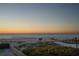 Oceanfront view at sunset over the beach at 3200 Gulf Blvd # 204, St Pete Beach, FL 33706