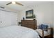 Bedroom with a queen-size bed and dresser, offering plenty of space at 3200 Gulf Blvd # 204, St Pete Beach, FL 33706