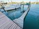 Spacious boat dock with a lift and walkway at 3200 Gulf Blvd # 204, St Pete Beach, FL 33706