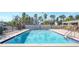 Clean and refreshing community pool with lounge chairs at 3200 Gulf Blvd # 204, St Pete Beach, FL 33706