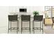 Kitchen boasts three black woven barstools at the island at 3645 Forest Path Dr, Plant City, FL 33565