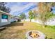 Large backyard with fire pit and storage shed at 3709 W Oklahoma Ave, Tampa, FL 33611