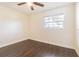 Spacious bedroom featuring dark wood floors and a window at 3709 W Oklahoma Ave, Tampa, FL 33611